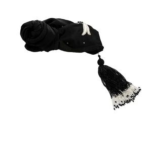 Black Julia Clancey silk turban with jeweled embellishments and beaded trim.